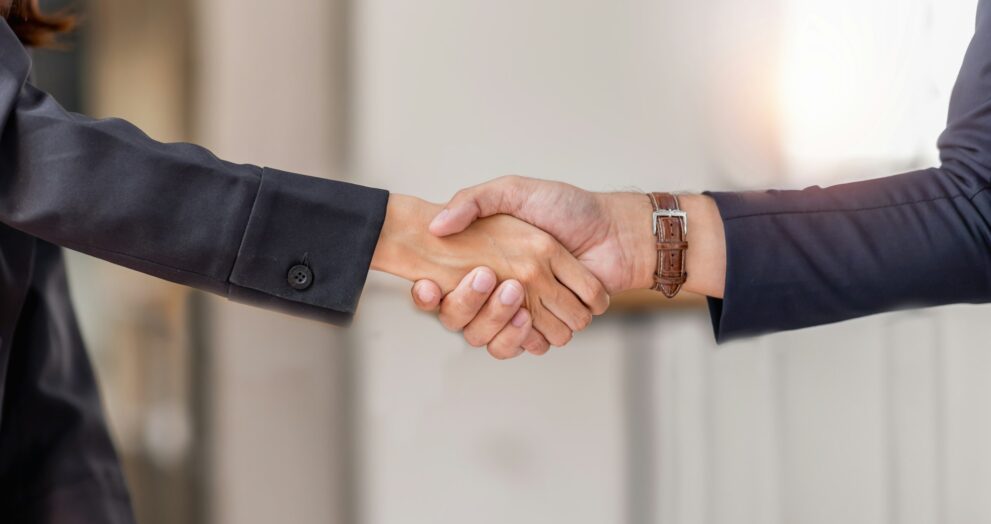 Business man offer and give hand for handshake in office. Successful job interview. Apply for loan