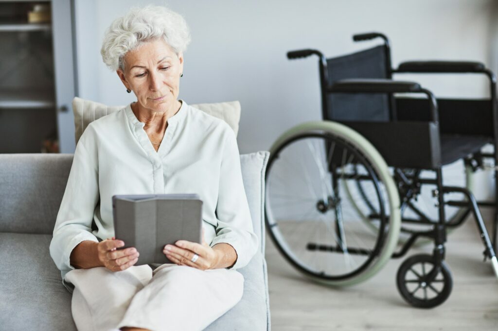 Senior Woman Using Tablet on Couch